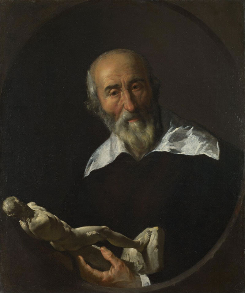 A Man holding an Armless Statuette