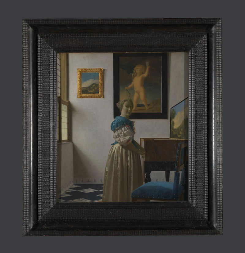 A Young Woman standing at a Virginal