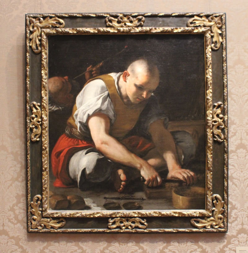 A Man Cutting Tobacco