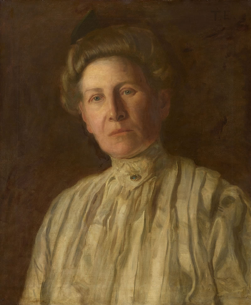 Portrait of a woman in a striped blouse against a brown background