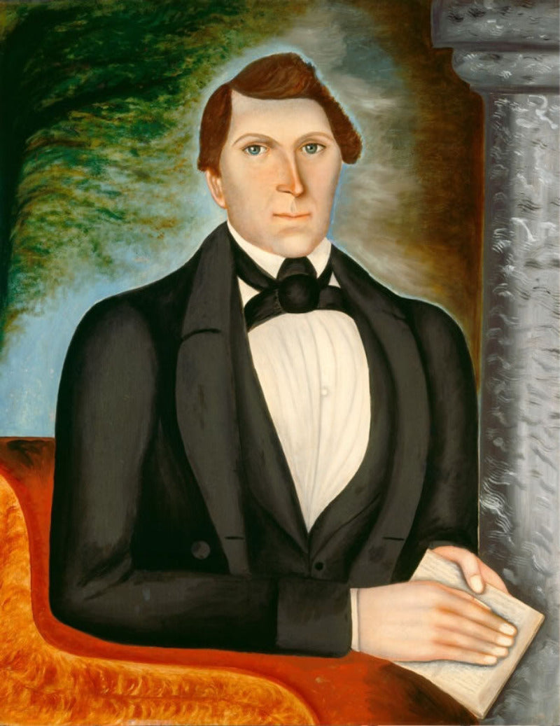 Portrait of a man in formal attire with a scenic background