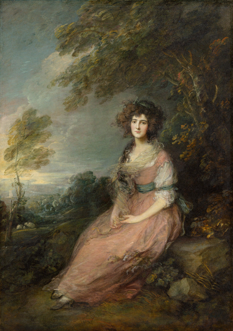 Portrait of a woman in a pink dress sitting outdoors with trees and sky in the background