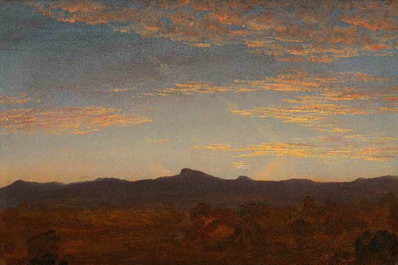 A landscape painting depicting a dramatic sunset or sunrise over a mountain range, with glowing orange and yellow clouds in a blue sky above dark silhouetted hills and foreground terrain.