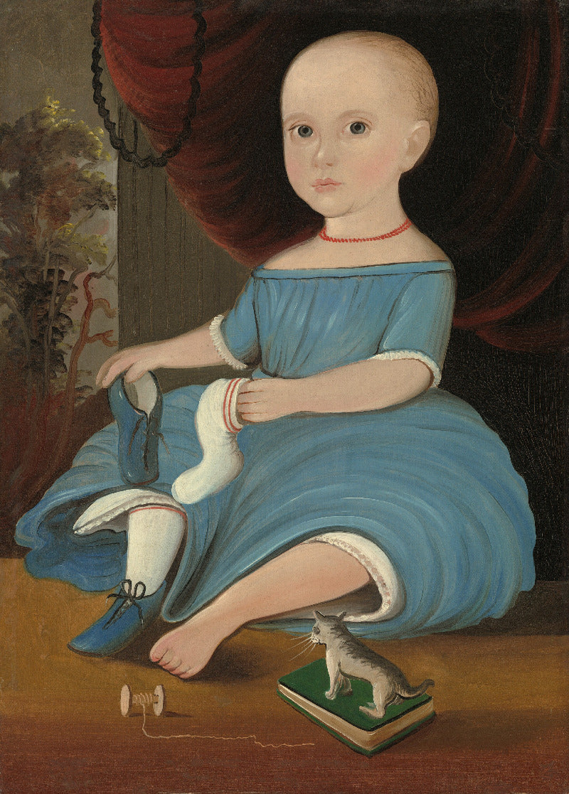 A historical oil painting of a young child seated indoors, wearing an off-the-shoulder blue dress with white cuffs and socks, holding a white sock. A small cat stands on a green book in the foreground, with a red curtain behind the figure.